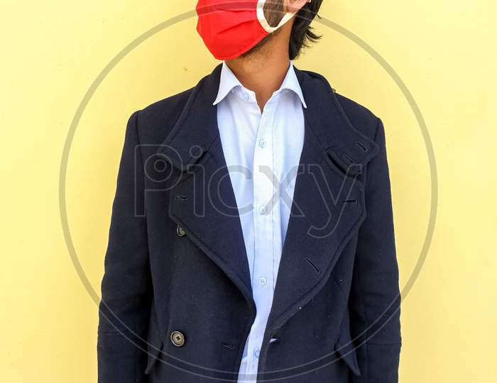 Studio shot of a young India smart man wearing coronavirus mask to protect from the coronavirus
