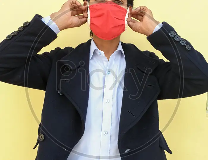 Download Image Of Photo Of A Smart Man Adjusting His Coronavirus Mask During Lockdown With Yellow Color Background Sx983749 Picxy PSD Mockup Templates