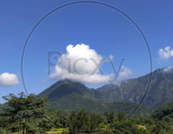 Mountains and clouds with blue sky