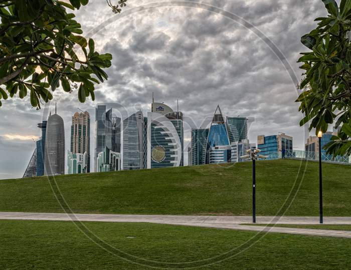 Doha, Qatar  Skyline daylight view from Sheraton park  with clouds in sky in background