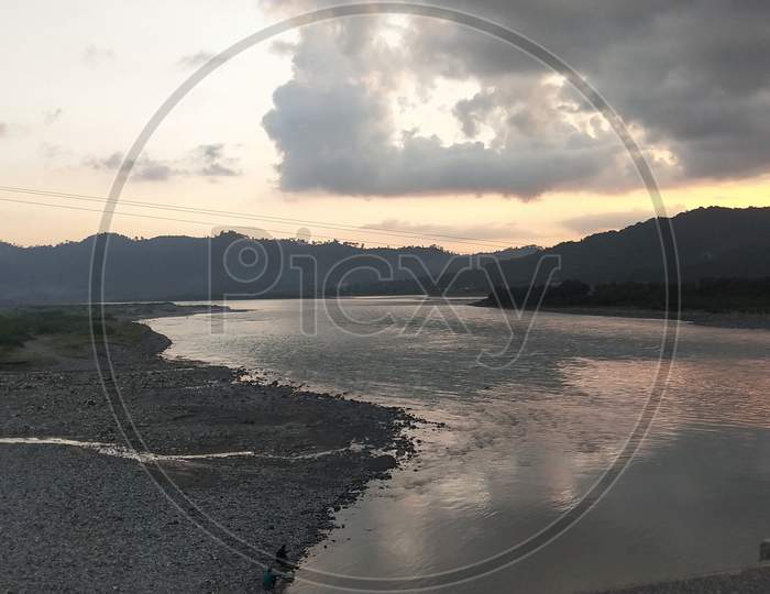 River view with sky and mountains in evening