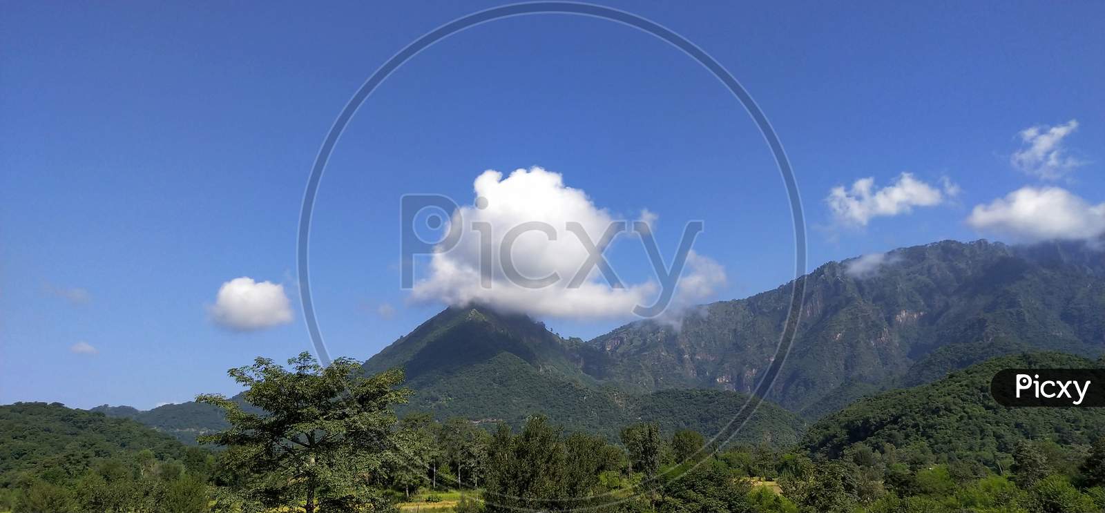 Mountains and clouds with blue sky
