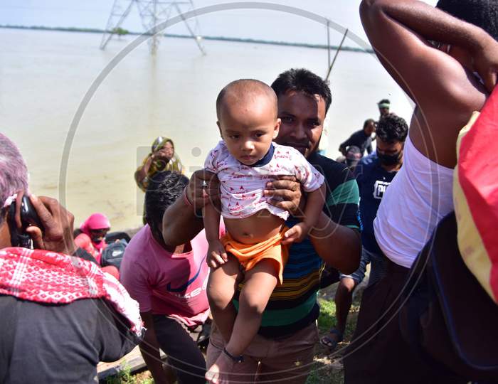 Flood Affected Villagers Arrive At A Safer Place On A Country Boat At  Jamunamukh  Village In Hojai District Of Assam On May 29,2020.