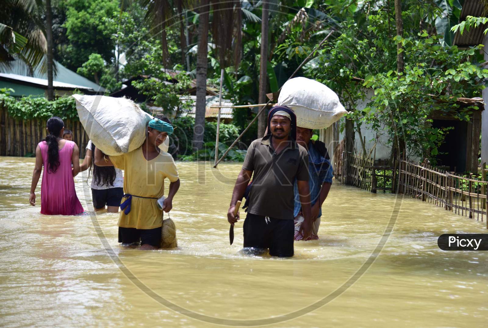 Villagers  Carrying Their  Belongings Shift To A Safer Place During Floods At Kampur  In Nagaon District Of Assam On , May 29, 2020.