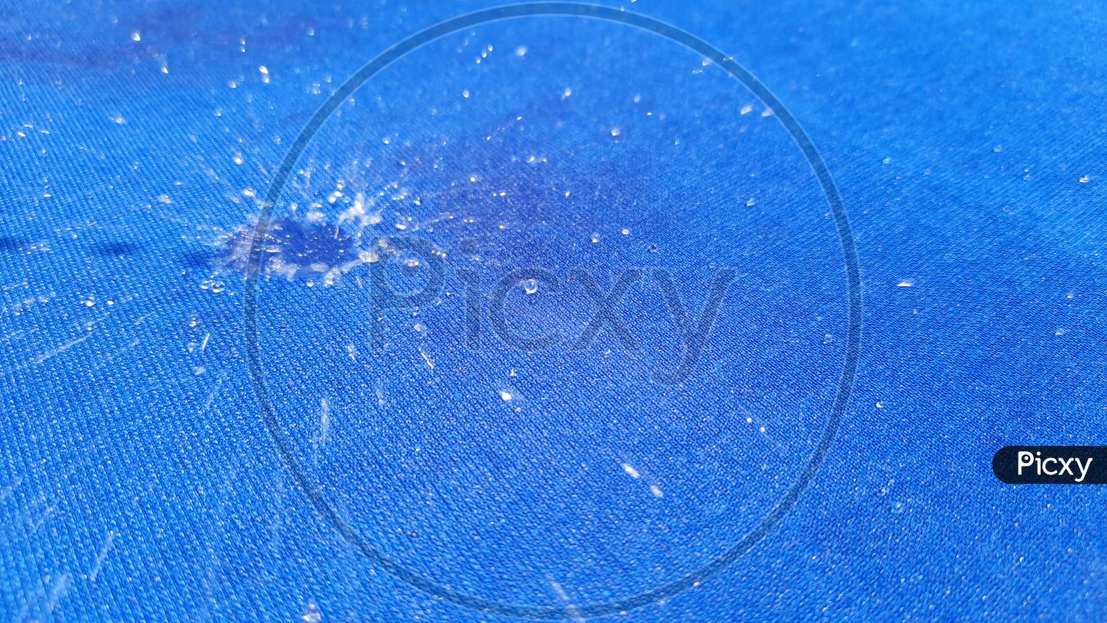 Shiny Rain Drop On Closeup (Space For Text) ,Rain Drop ,Water Drop On The Blue Fabric Shoot ,Super Macro