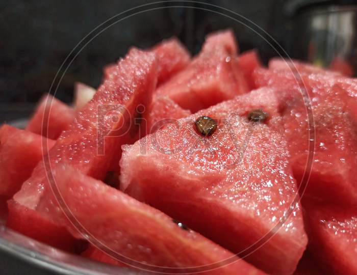 Sliced watermelon and seeds close up