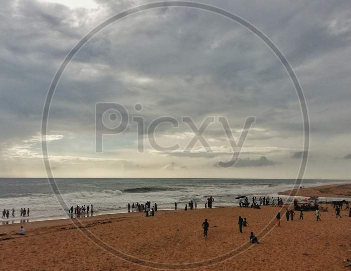 Landscape Image Of Crowded Veli Beach During Cloudy Weather In Trivandrum, Kerala, India.