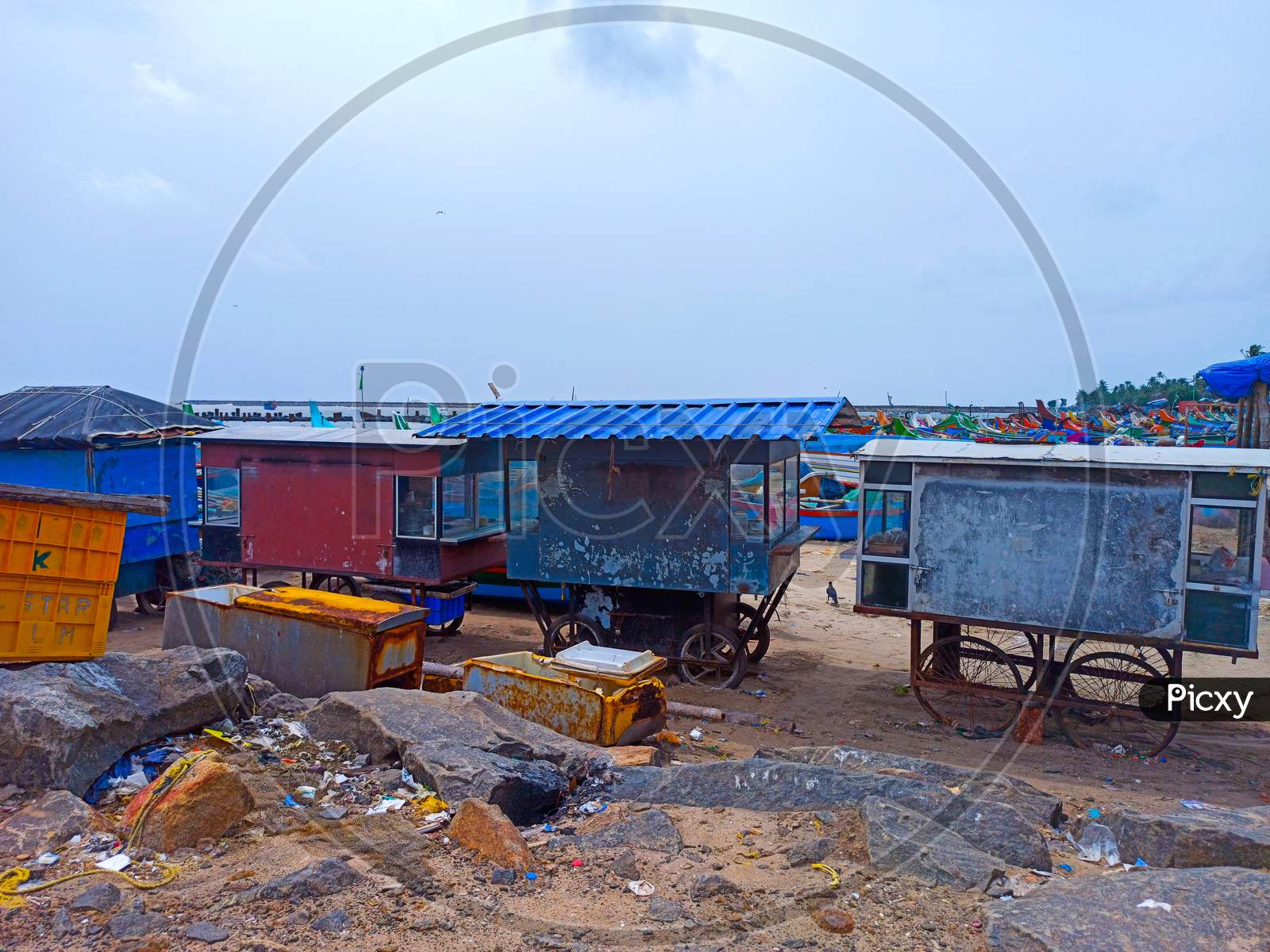 Beach movable sales counters in a harbour