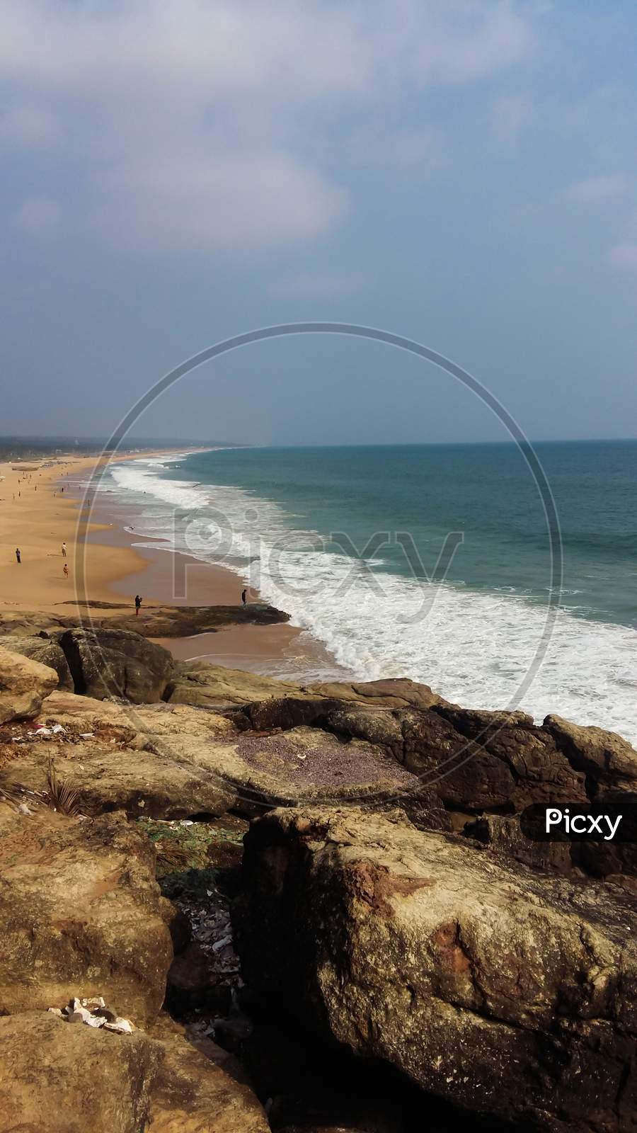 Image Of Azhimala Beach In Trivandrum, India. Arabian Sea And Rocky Shores.