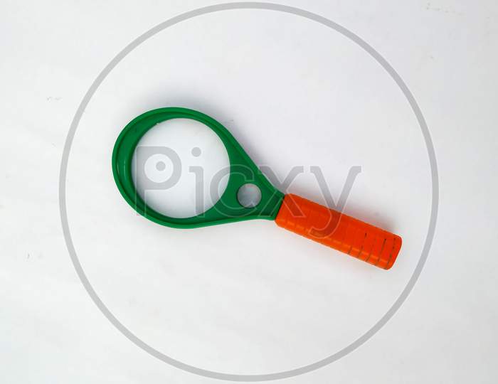 green Magnifying glass isolated on white background