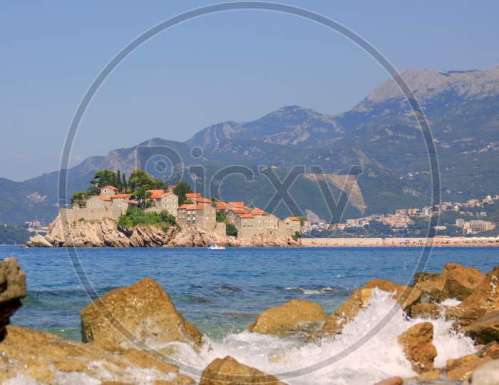 Sveti Stefan island and waves of sea, Montenegro