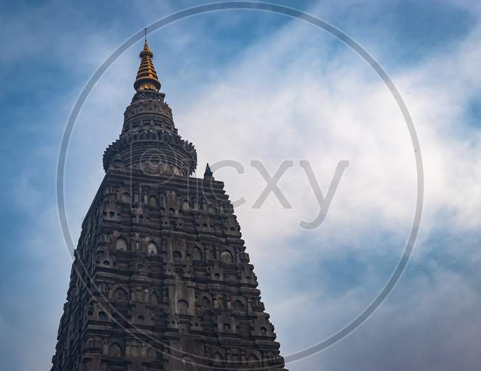 Buddhist Stupas Isolated With Bright Sky And Unique Prospective Image Is Taken At Mahabodhi Temple Bodh Gaya Bihar India. It Is The Enlightened Place Of Grate Budha And Very Religious For Buddhist.