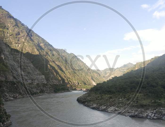 Chinab river landscape with mountains and sky