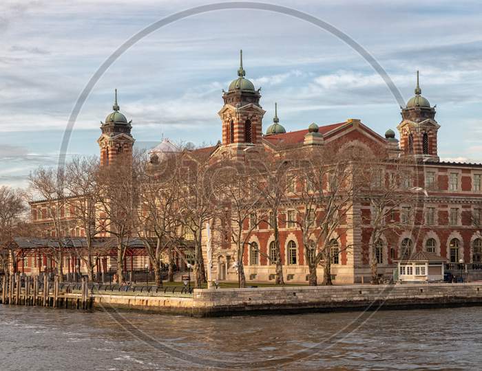 Immigration museum in Ellis Island-New York City, USA- Daylight view with clouds in sky in background