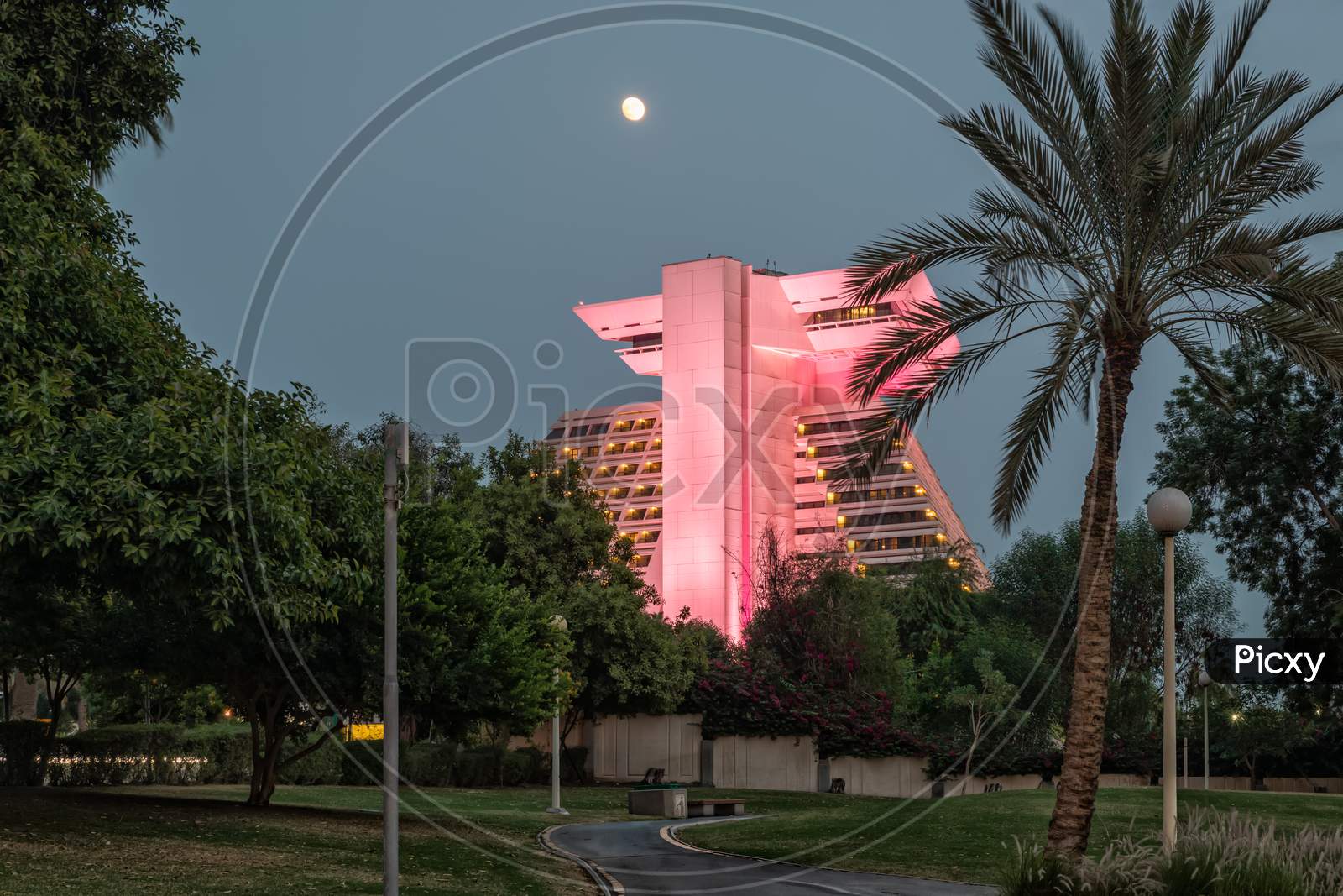 Sheraton Al Doha  Hotel in Qatar at dusk exterior view from Sheraton park