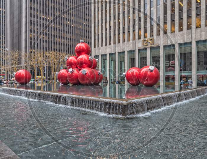 Giant Christmas ornament balls outside Rockefeller center on Sixth Ave, New York city,USA.