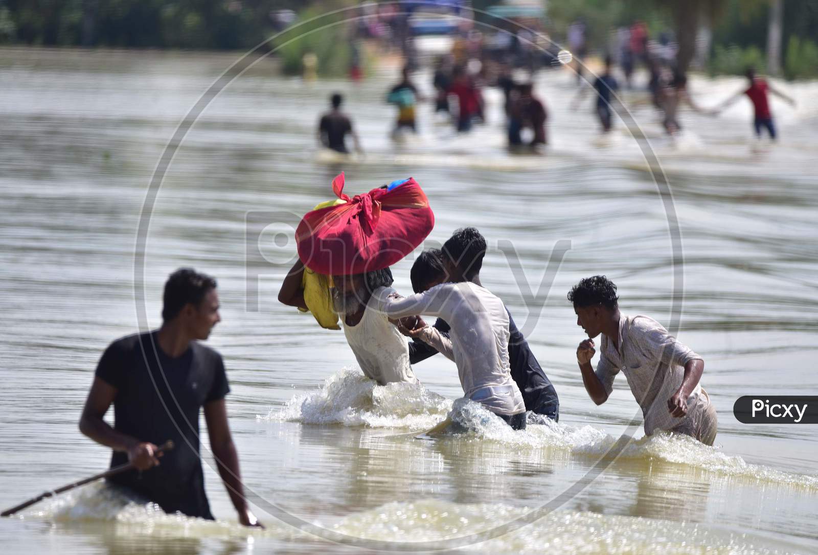 Villagers  Carrying Their Belongings Shift To A Safer Place At  Flood-Affected Jamunamukh  Village In Hojai District Of Assam On May 29,2020.
