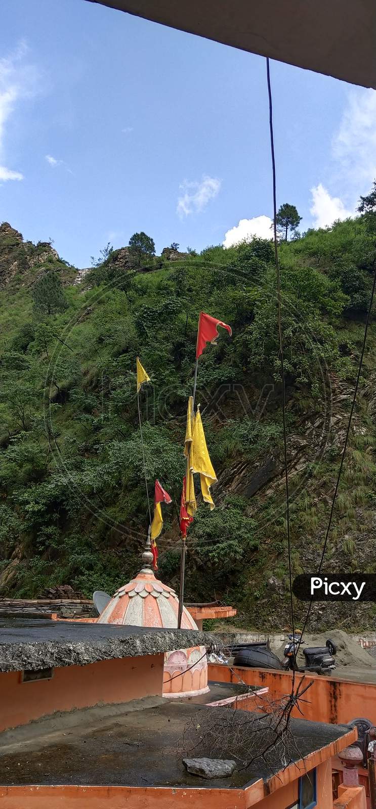 Colorful holy flags in forest