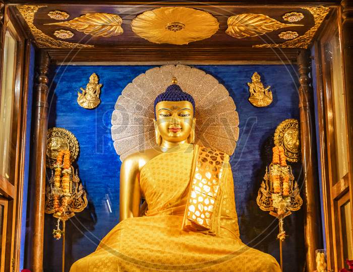 Budhha Golden Statue Isolated In Details