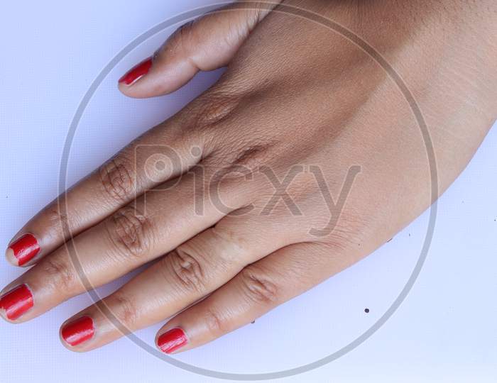 Two woman hands with red manicure. Isolated on white background.