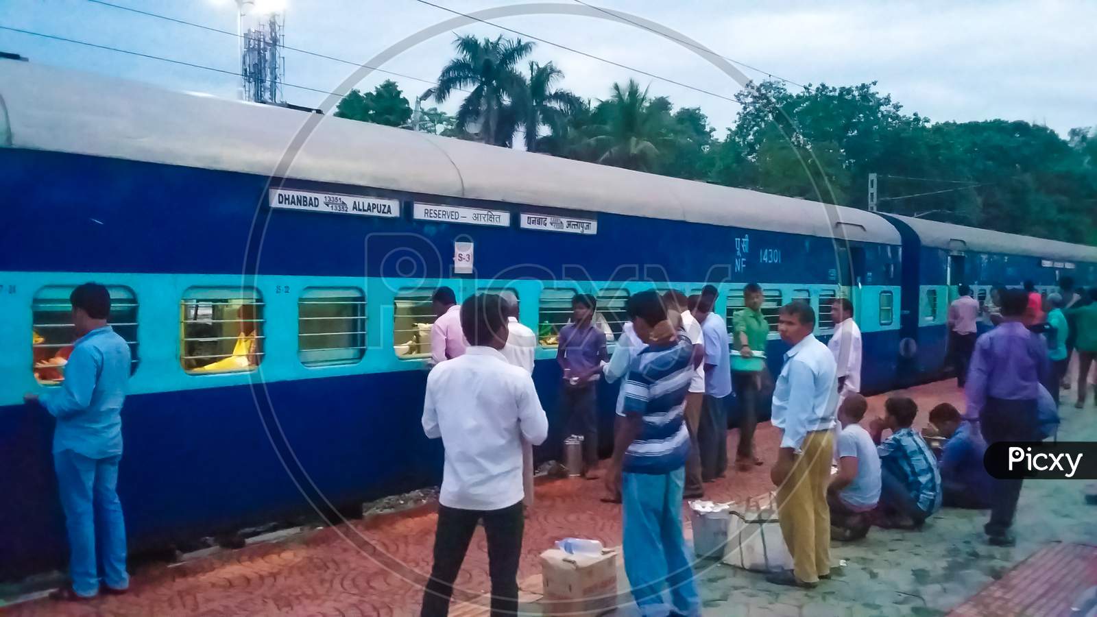 Indian Express AC blue train and platform