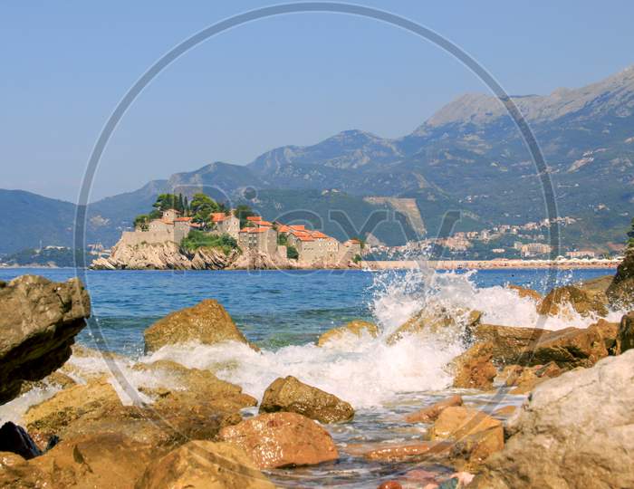 Sveti Stefan island and waves of sea, Montenegro