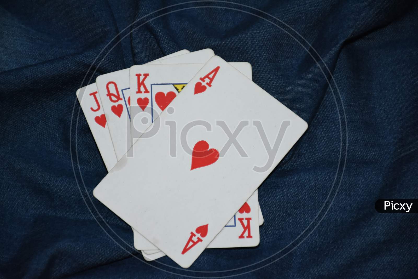 Deck of card in denim background . Playing cards . Ace of heart . king . Queen.