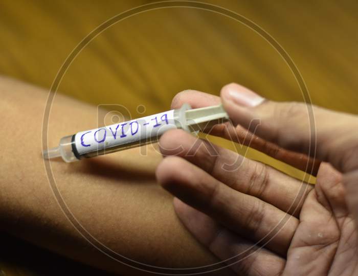 corona antivirus vaccines in a boy hand with blur background
