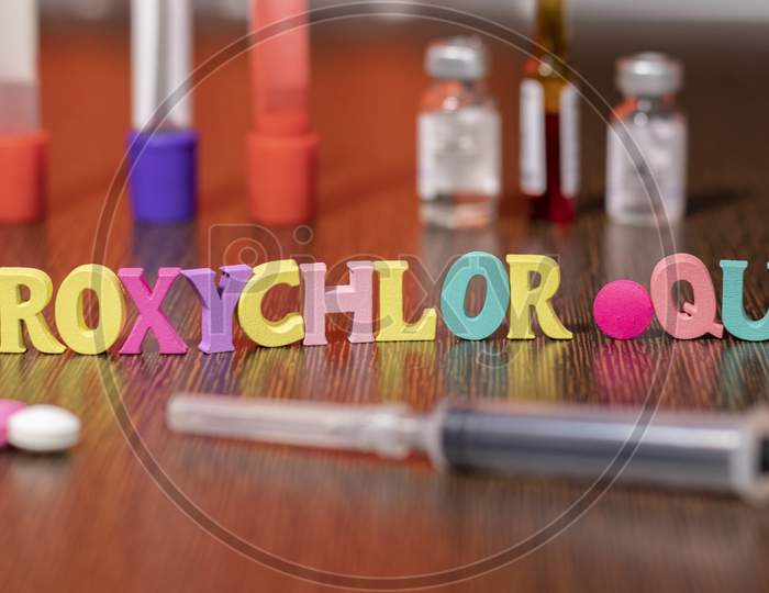 Hydroxychloroquine Or Hcq Drug In Colourful Letters On Table Used For Malaria.