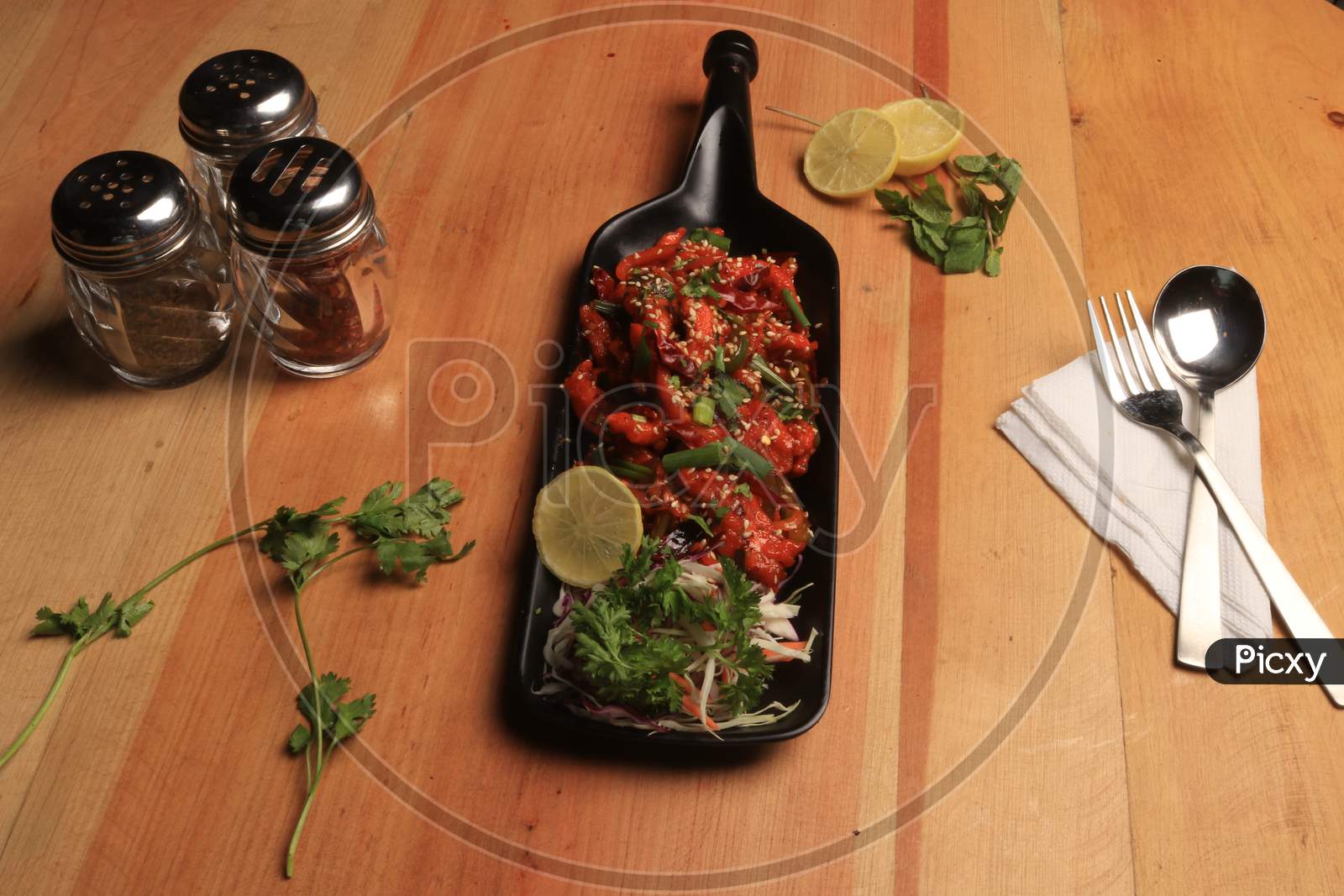 Indian Starter Chilli chicken, served in a plate. Selective focus