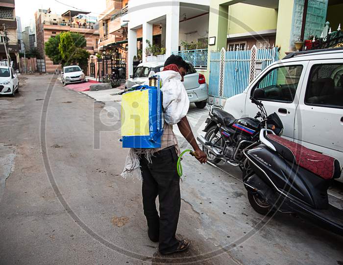 Jodhpur, Rajashtbn, India. 30 March 2020. Coronavirus. Indian Sanitation Worker Wearing Mask Spraying And Cleaning The Streets With Alcohol Based Solution To Disinfect Public Areas And Roads.