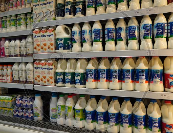 India - Milk Bottles Arranged On Shelves For Sale. Variety Of Sizes. Also Present Flavored Milk Strawberry Milk, Camel Milk, Coconut Milk, Almond Milk. Almarai Brand Milk Bottles.