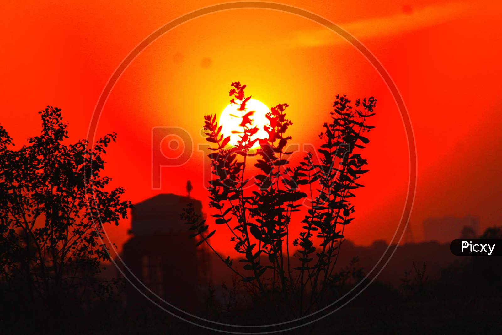 Sunset from a small hill with orange look of sun