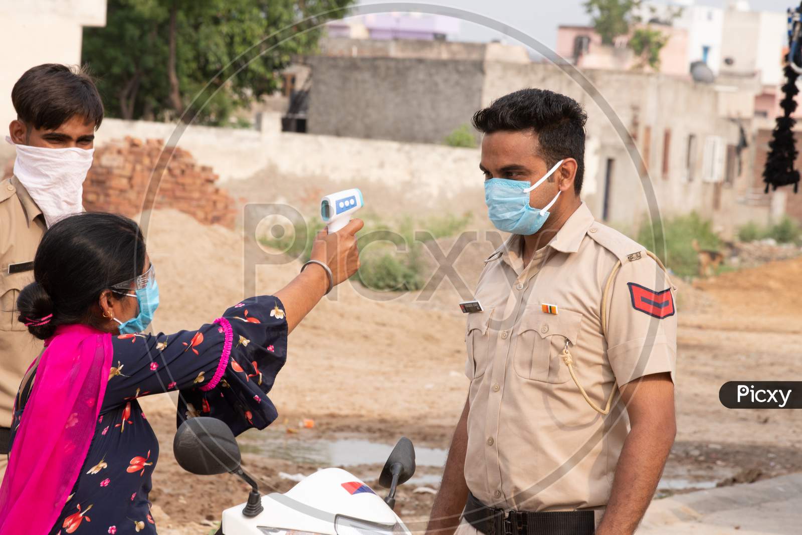 Ambala City, Haryana/India -04/30/2020  Health workers checking body temperature of police during Routine Checkup to avoid covid infection in   Police