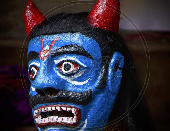 traditional Indian face mask worn by a folk performer