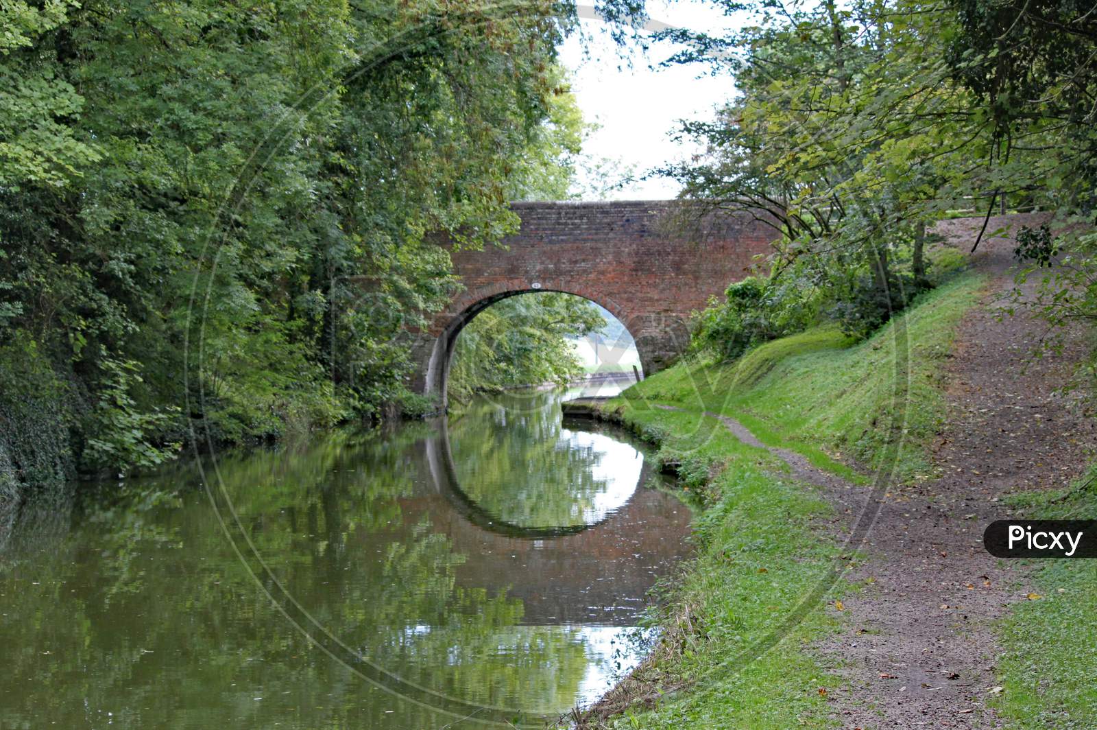 An Arched Bridge On The Grand Union Canal At Lapworth In Warwickshire, England