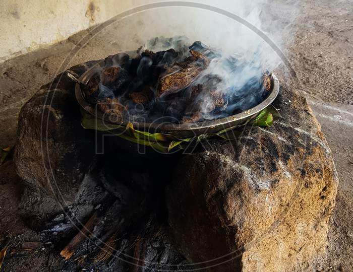 village style food making in Clay oven with beautiful red fire