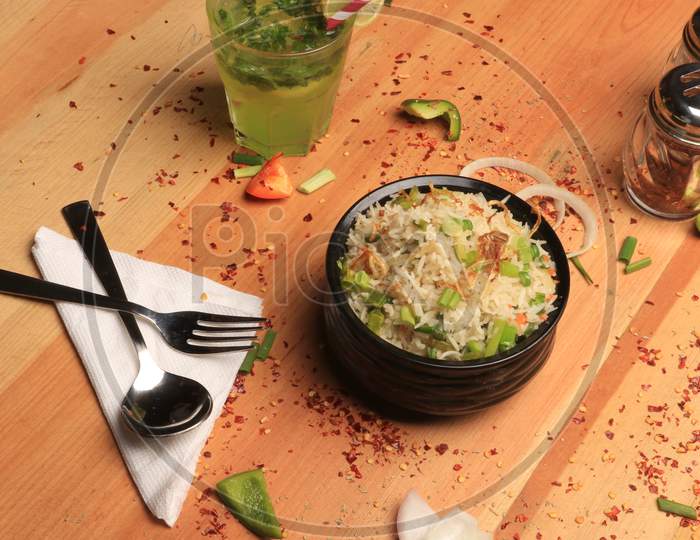 Mix vegetables with rice and shrimp on wood background