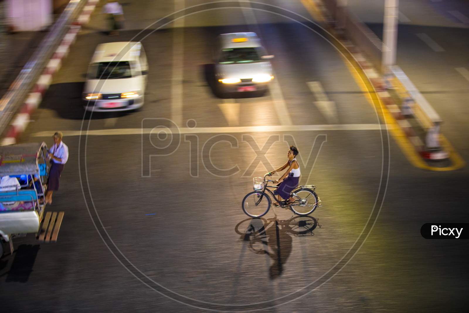 People Crossing the Road on a bicycle