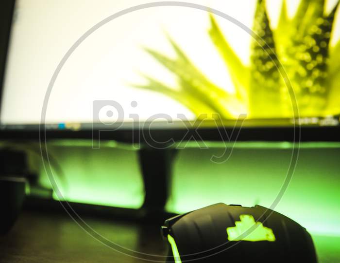 Gaming mouse for desktop, Gaming desktop setup with RGB colors, selective focus on object with blurred background