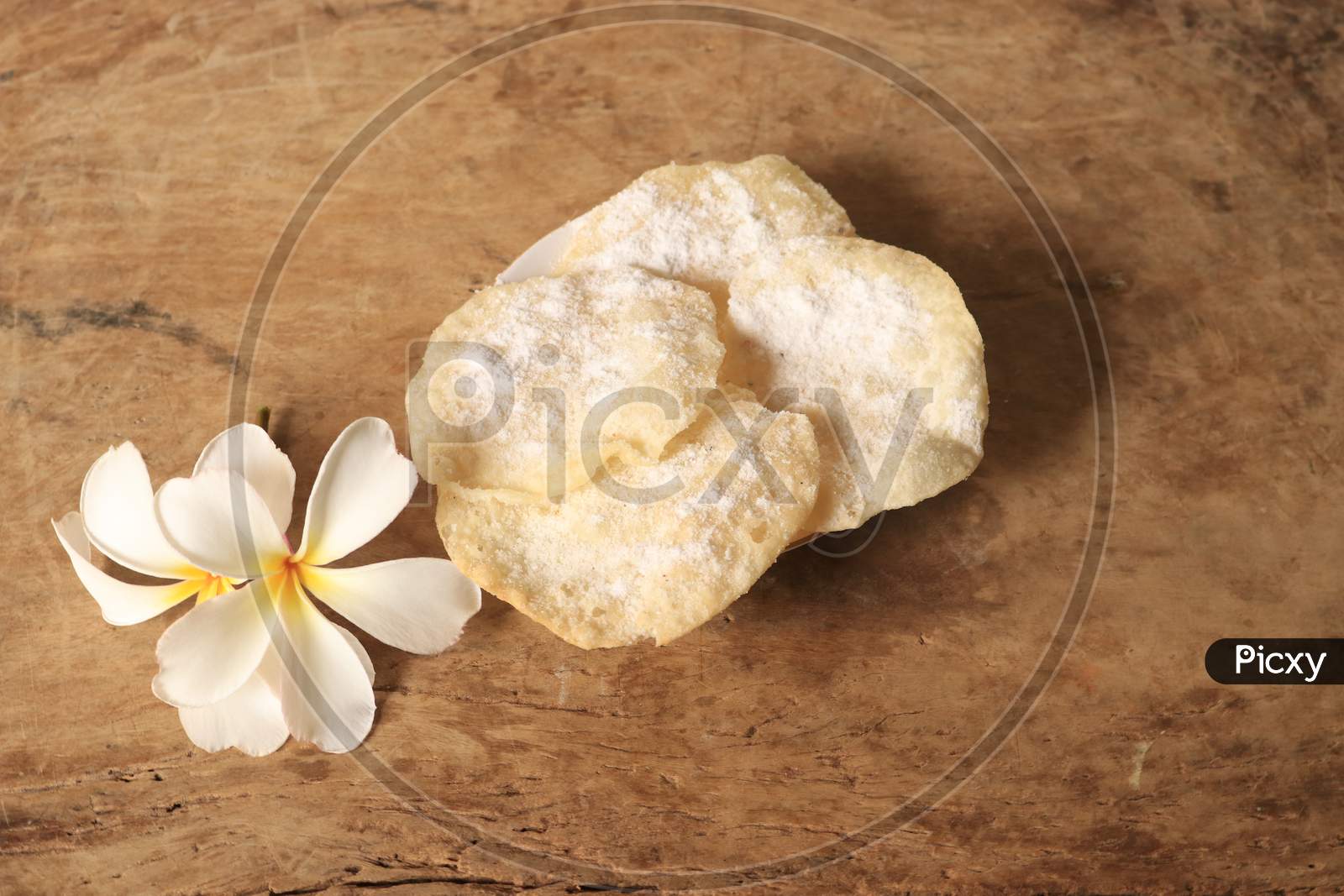 Indian Sweet Savory or Snack Sugar Soaked Poori or Puri On Isolated Background