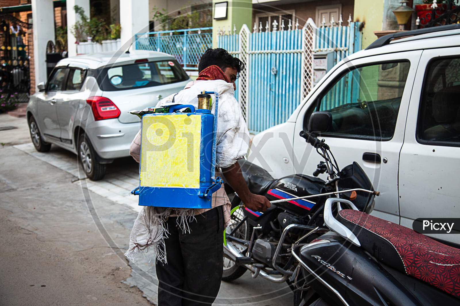 Jodhpur, Rajashtbn, India. 30 March 2020. Coronavirus. Indian Sanitation Worker Wearing Mask Spraying And Cleaning The Streets With Alcohol Based Solution To Disinfect Public Areas And Roads.