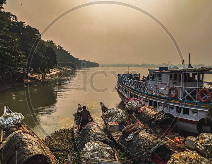 Boats are tied together on Ganges River, Polluted water of river in city, garbage on river. landscape view of Ganges river