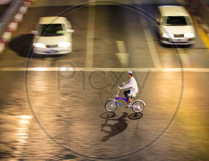 People Crossing the Road on a bicycle