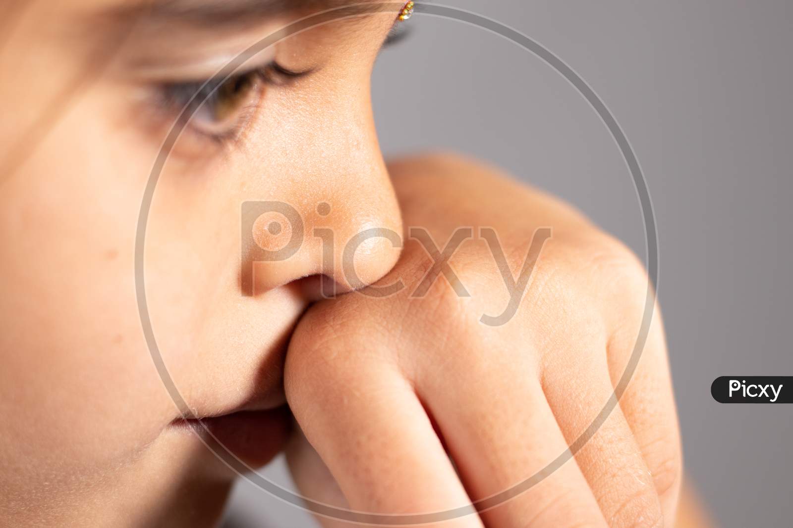 Extreme Close Up Of Child Touch'S Her Nose - Concept Showing To Prevent And Avoid Touching Your Nose. Protect From Covid-19 Or Coronavirus Spreading Or Outbreak - Don T Touch Your Nose.