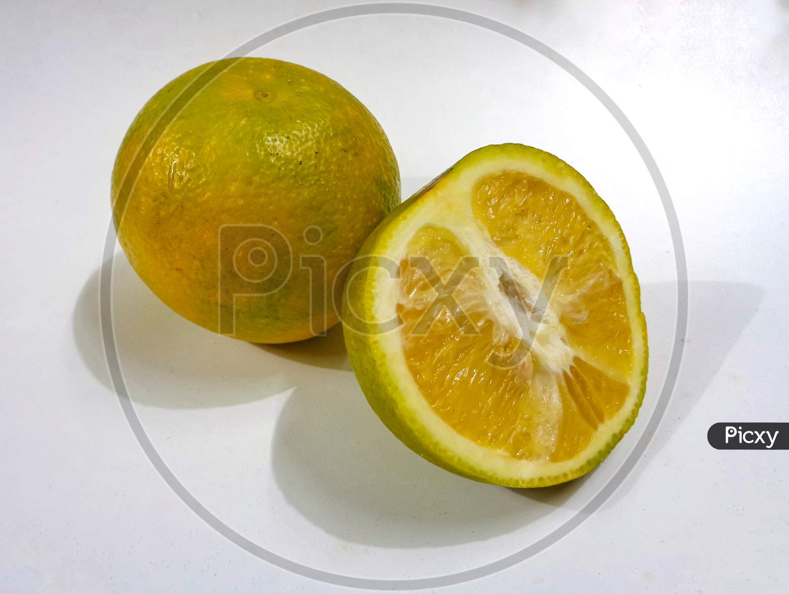 Mosambi or sweet lemon isolated on white background