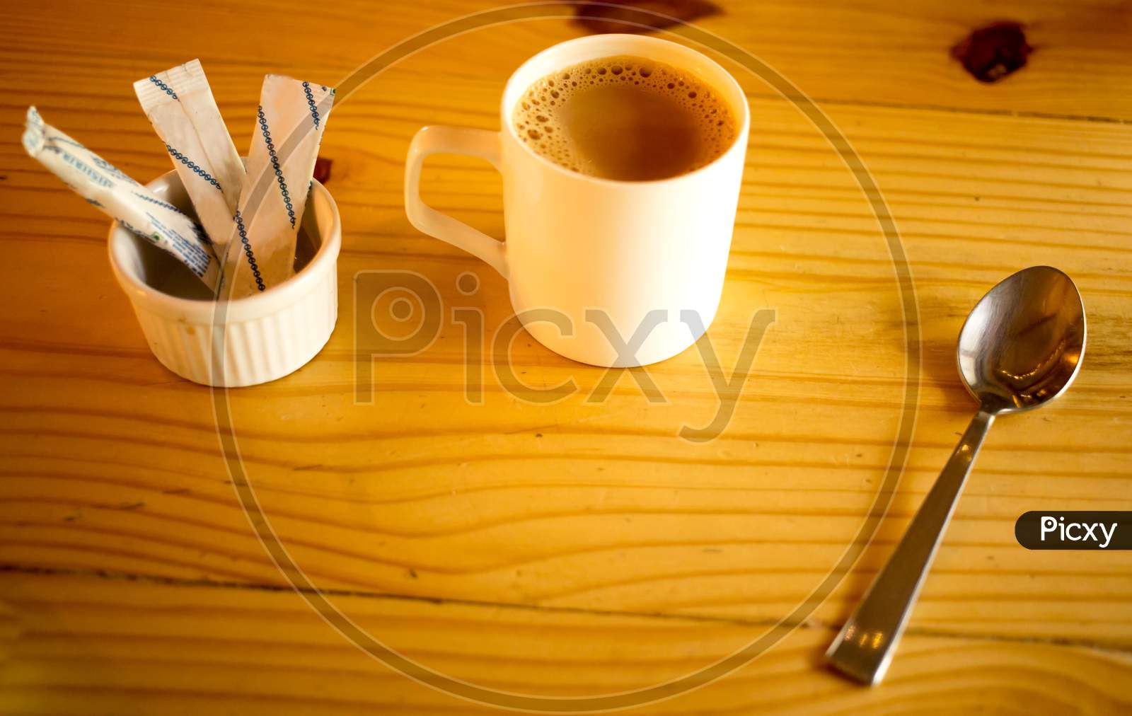 Coffee cup With sugar and spoon in  Cafe