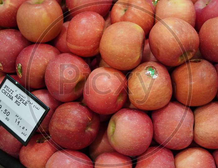 Dubai Uae - November 2019: Bunch Of Pink Apples On Boxes In Supermarket. Apple Put On Sale Shelves In The Supermarket. Fresh Ripe Apples Displayed Beautifully.