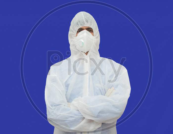 Confident Epidemiologist In Hazmat Suit With Medical Face Mask - Concept To Fight Covid-19 Or Coronavirus Outbreak By Controlling Virus Spread.