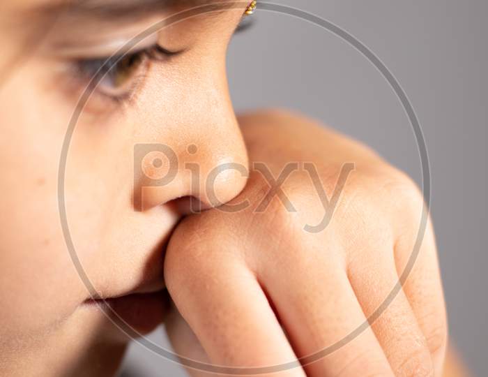 Extreme Close Up Of Child Touch'S Her Nose - Concept Showing To Prevent And Avoid Touching Your Nose. Protect From Covid-19 Or Coronavirus Spreading Or Outbreak - Don T Touch Your Nose.